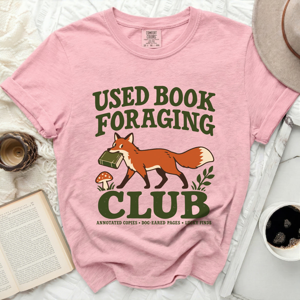 Pink t-shirt with "Used Book Foraging Club" text and fox graphic.