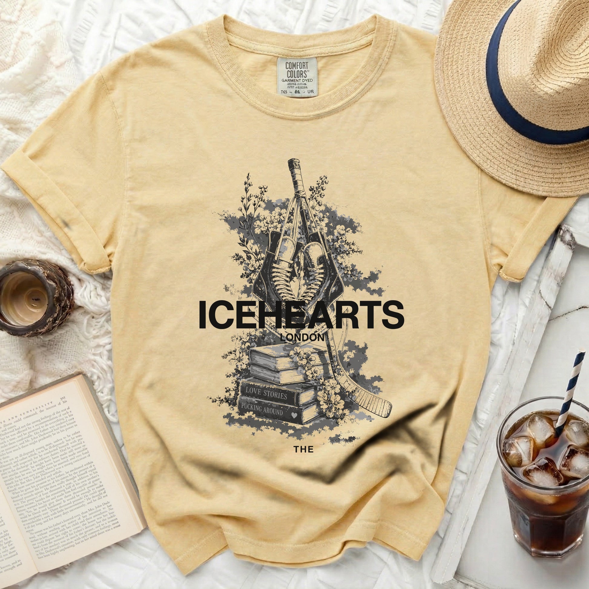 Yellow t-shirt with "ICEHEARTS LONDON" and hockey sticks graphic.