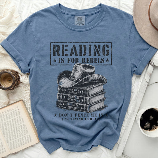 Blue t-shirt with "Reading is for Rebels" and stack of books graphic.