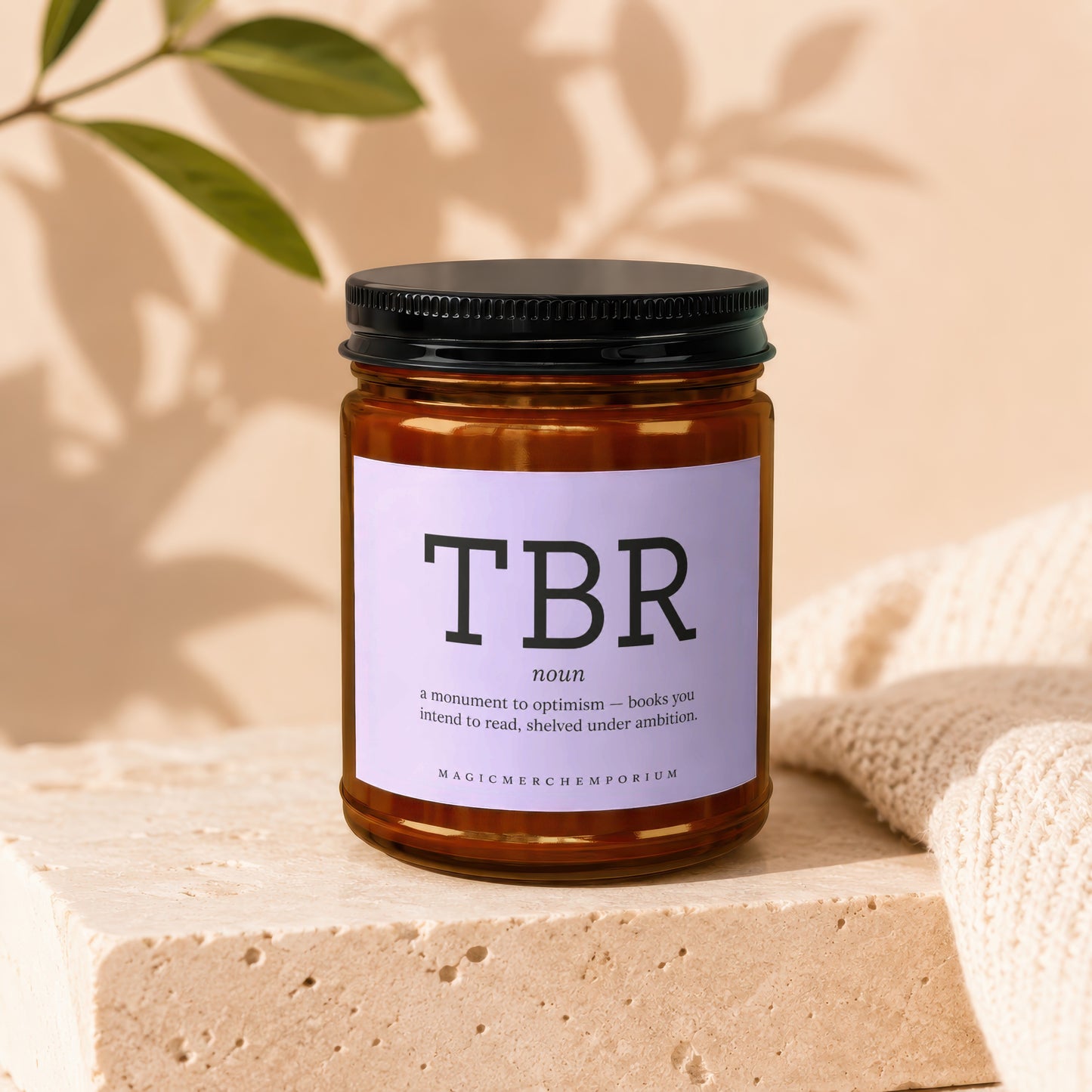 Brown glass candle with "TBR" and definition on label.