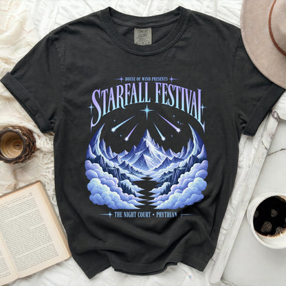 Black t-shirt with Starfall Festival graphic featuring mountains, clouds, and shooting stars.