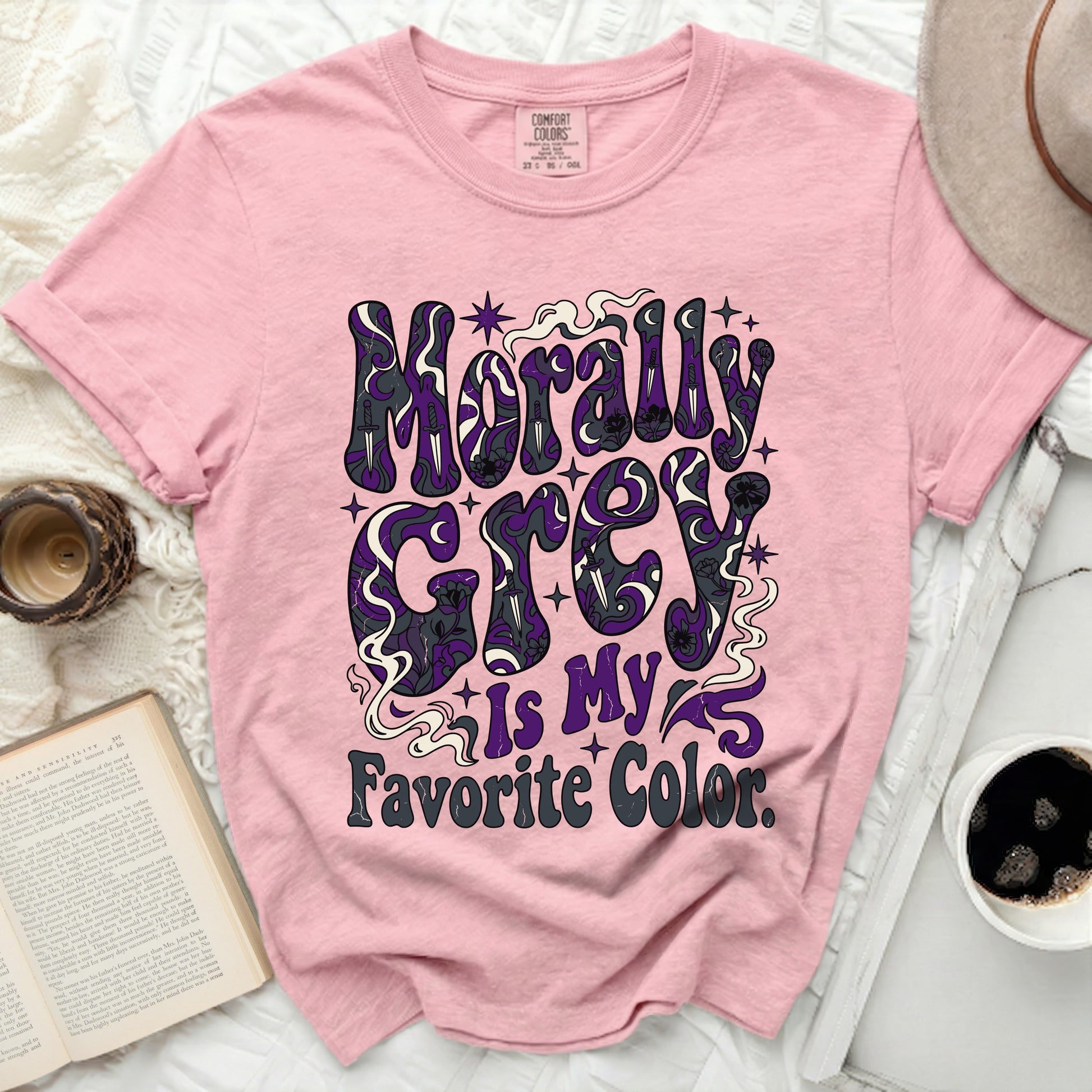 Pink t-shirt with "Morally Grey Is My Favorite Color" graphic.