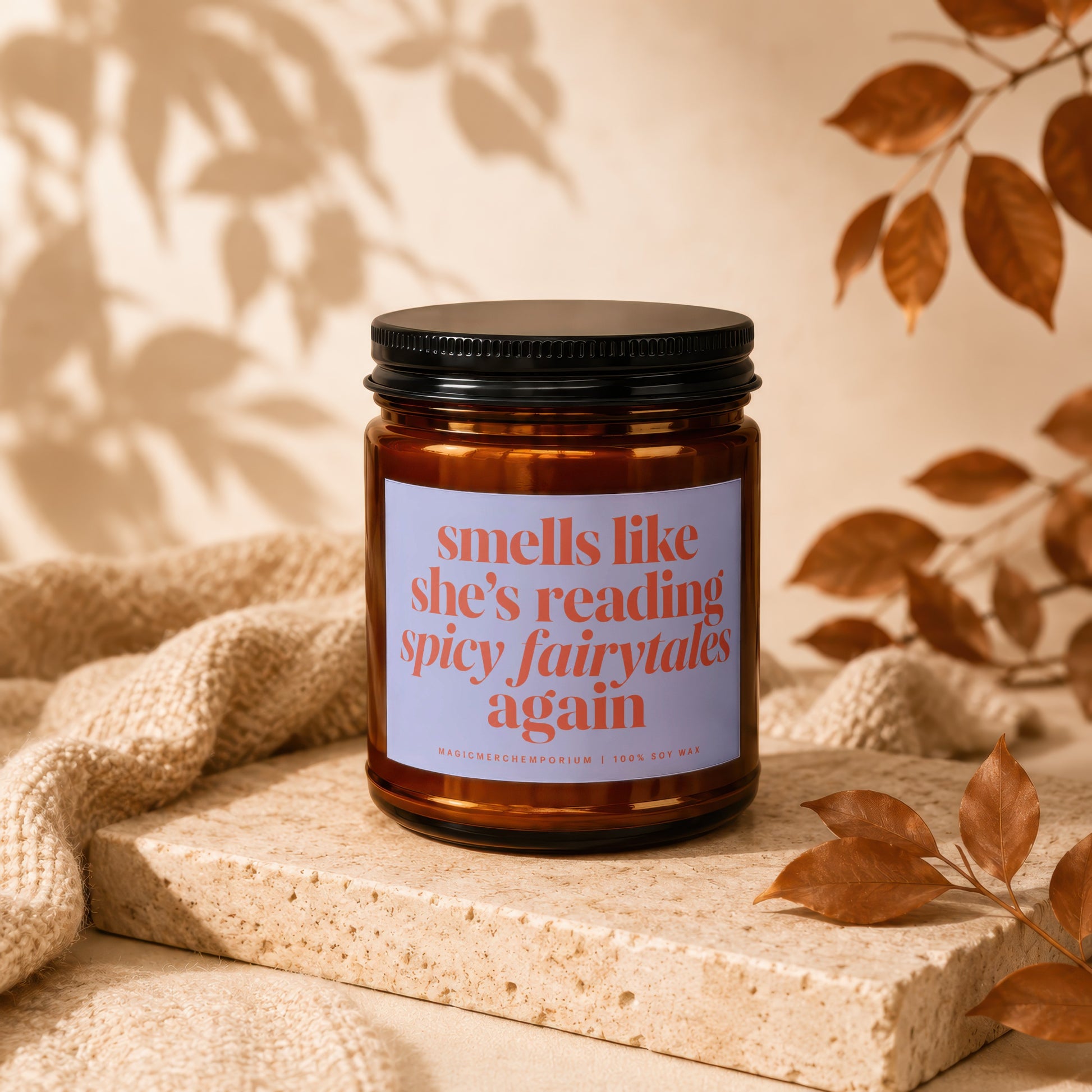Amber candle with label reading "smells like she's reading spicy fairytales again".