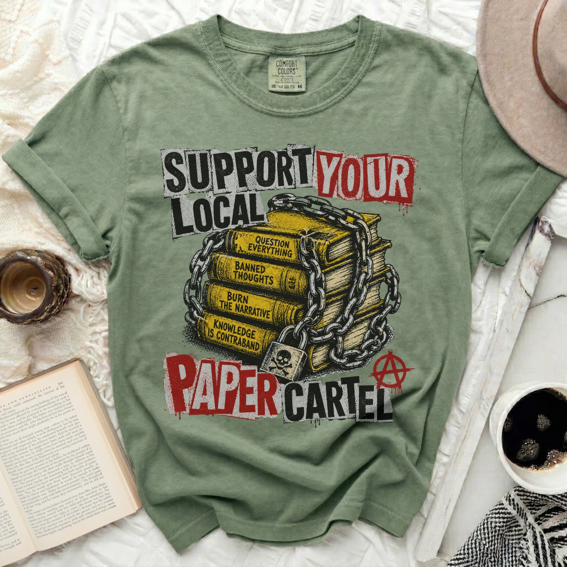 Green t-shirt with "Support Your Local Paper Cartel" text and chained books.