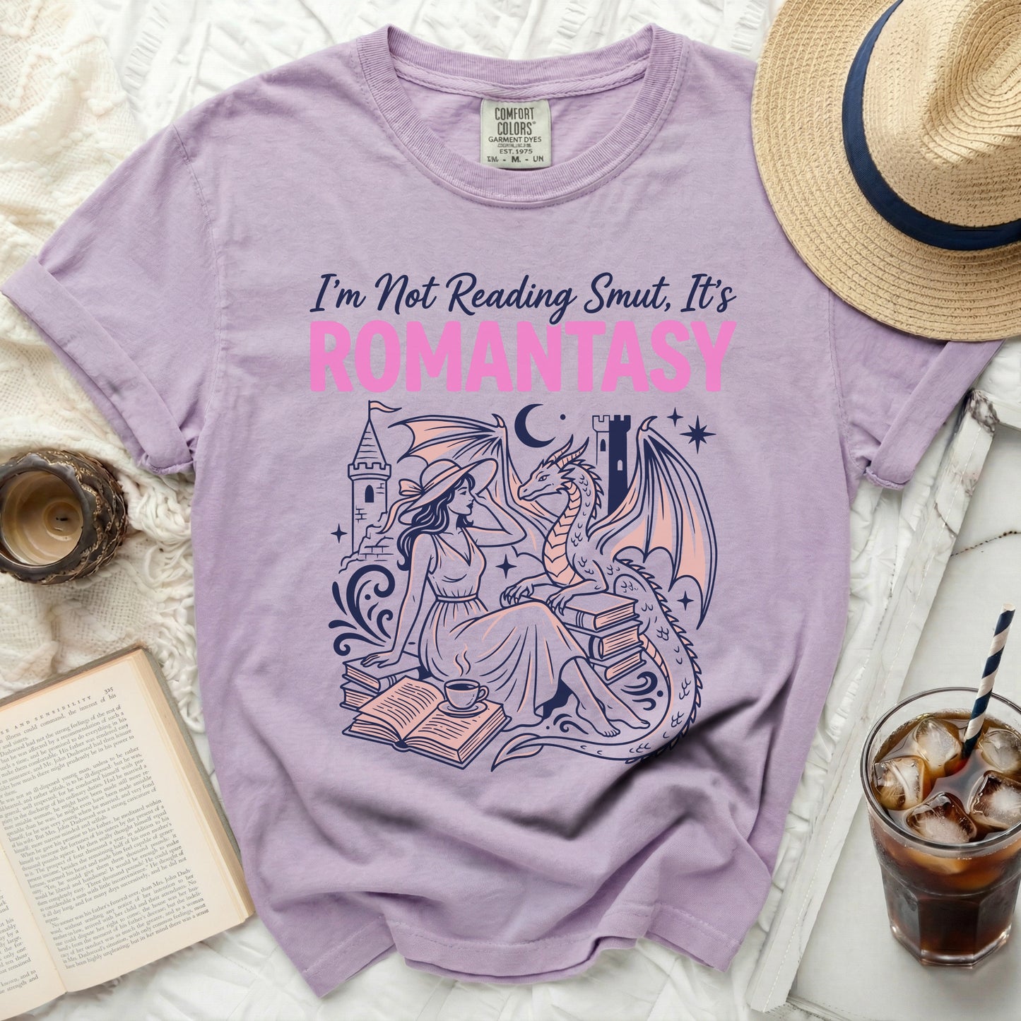 Purple t-shirt with "I'm Not Reading Smut, It's ROMANTASY" text and dragon illustration.