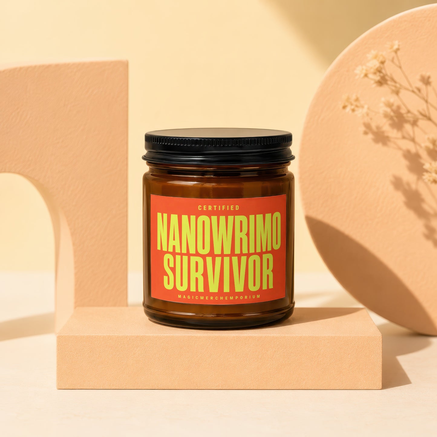 Amber jar candle with orange label reading "Certified Nanowrimo Survivor".
