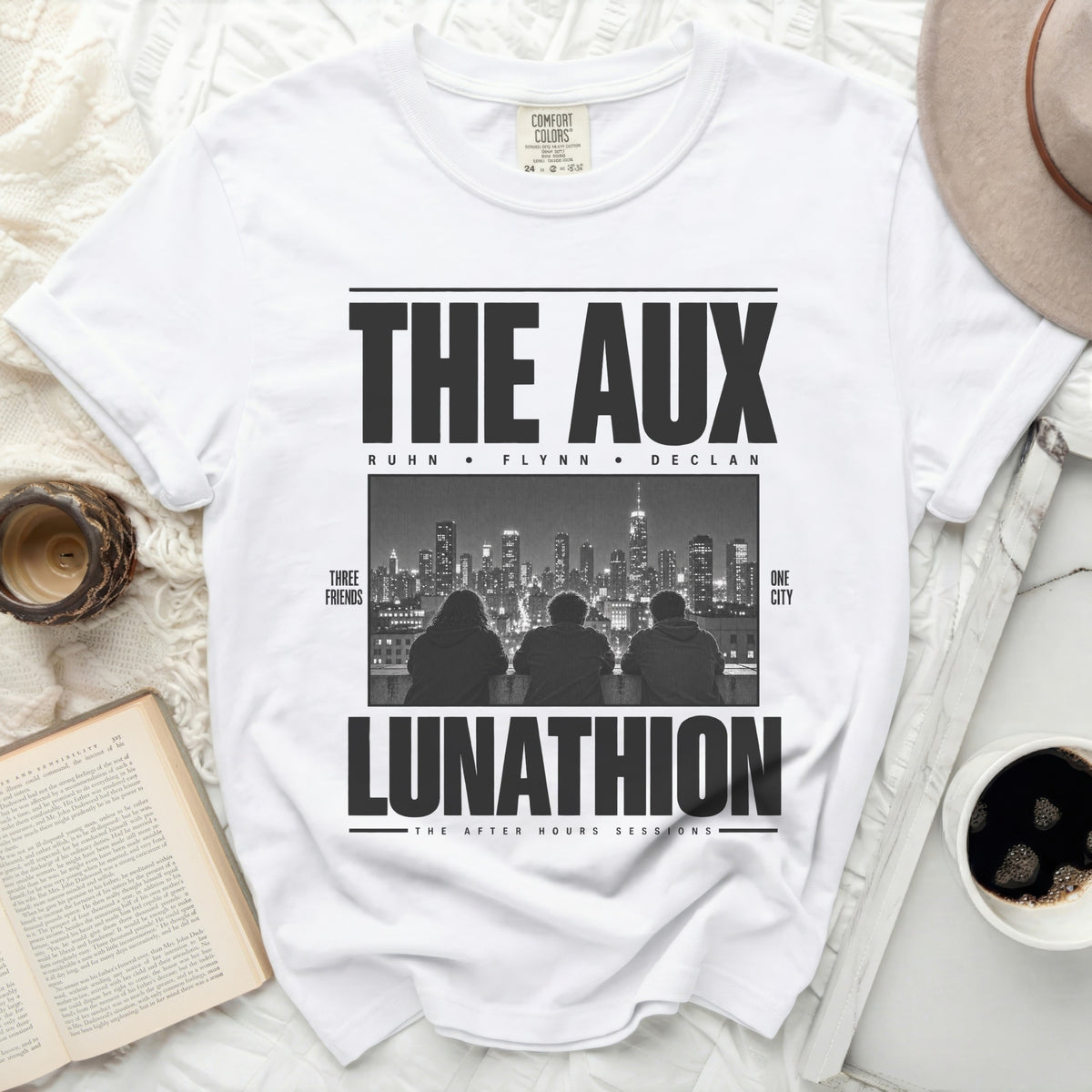 White t-shirt with "The Aux" graphic, "Ruhn Flynn Declan", and "Lunathion" text.