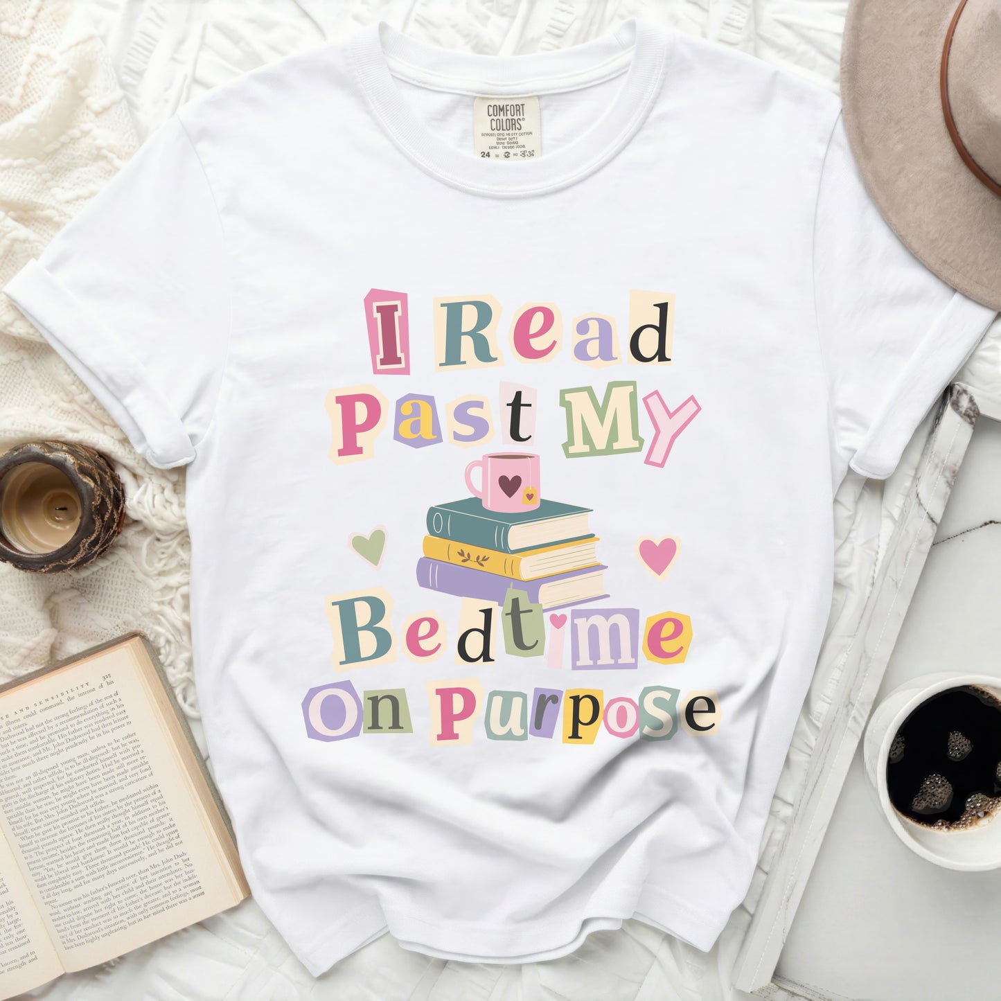 White t-shirt with the text "I read past my bedtime on purpose."