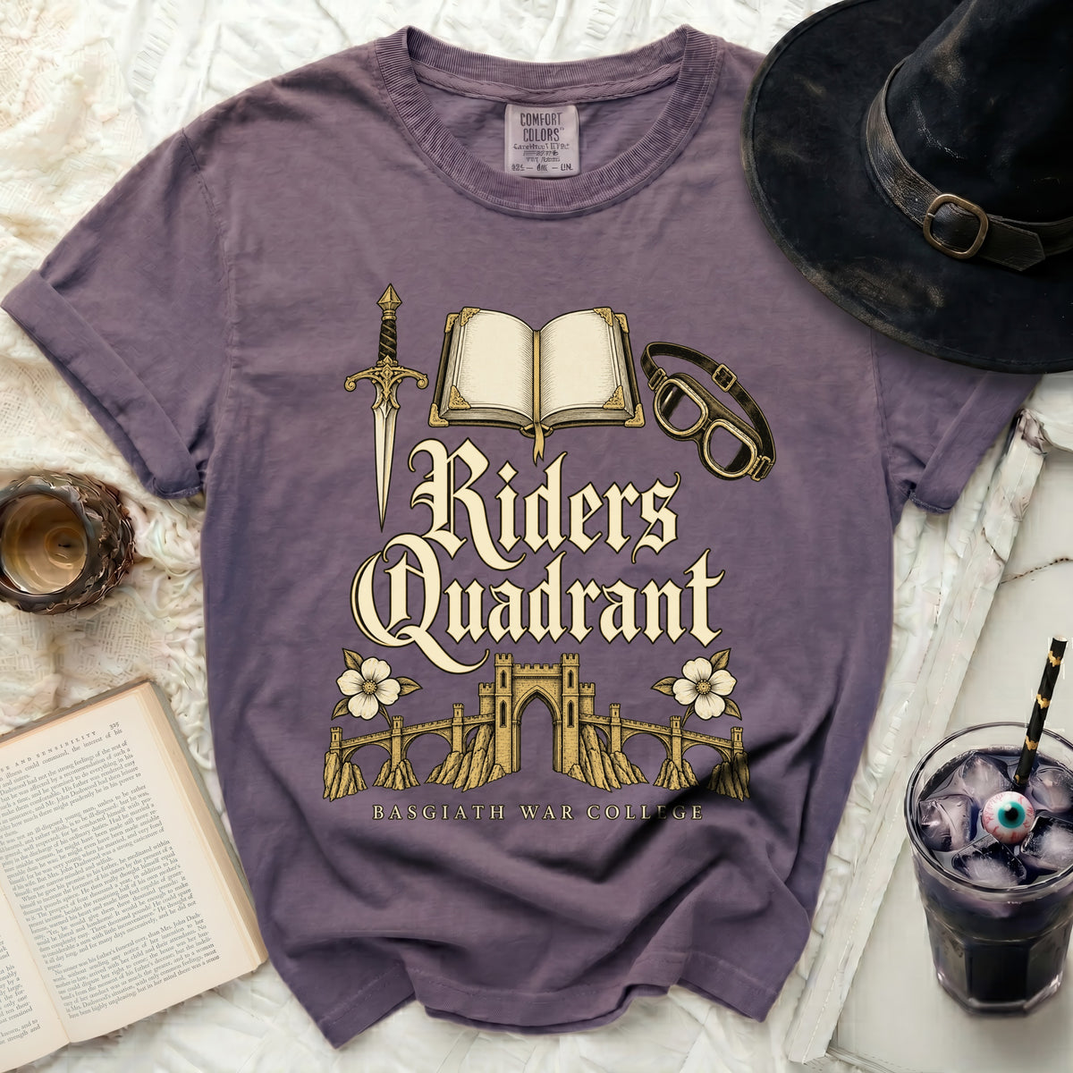 Purple t-shirt with gold text "Riders Quadrant Basgiath War College" and graphics.