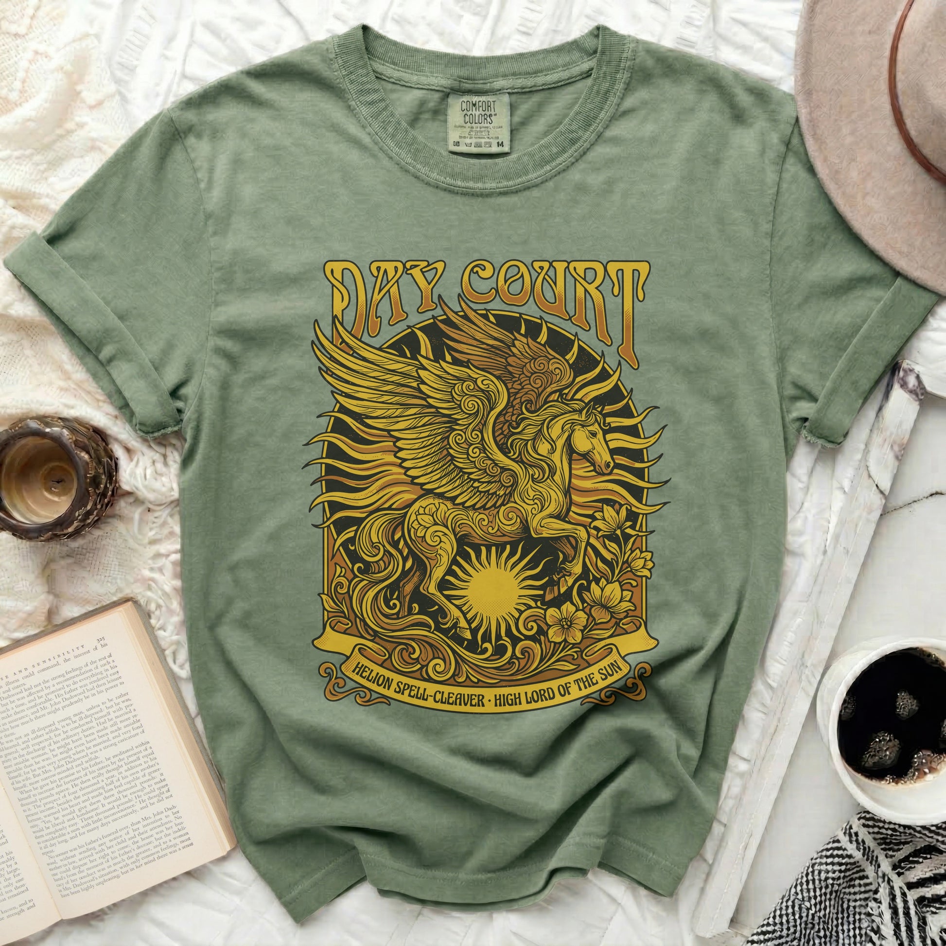 Green t-shirt with a winged Pegasus and sun graphic, text "SKY COURT" and "HELION SPELL-CLEAVER".