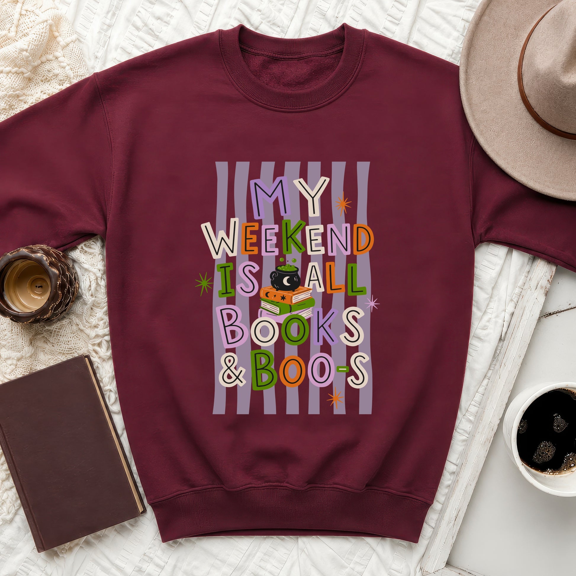 Bordeaux sweatshirt with "My weekend is all books & boos" Halloween graphic.
