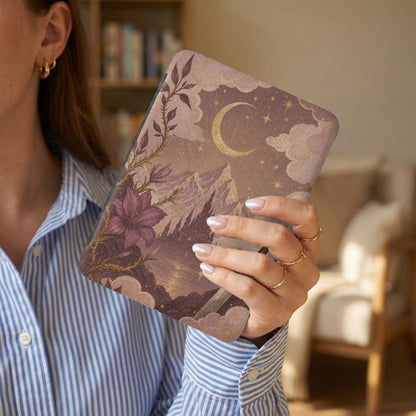 Device with celestial, mountainous, castle and floral artwork and moon.
