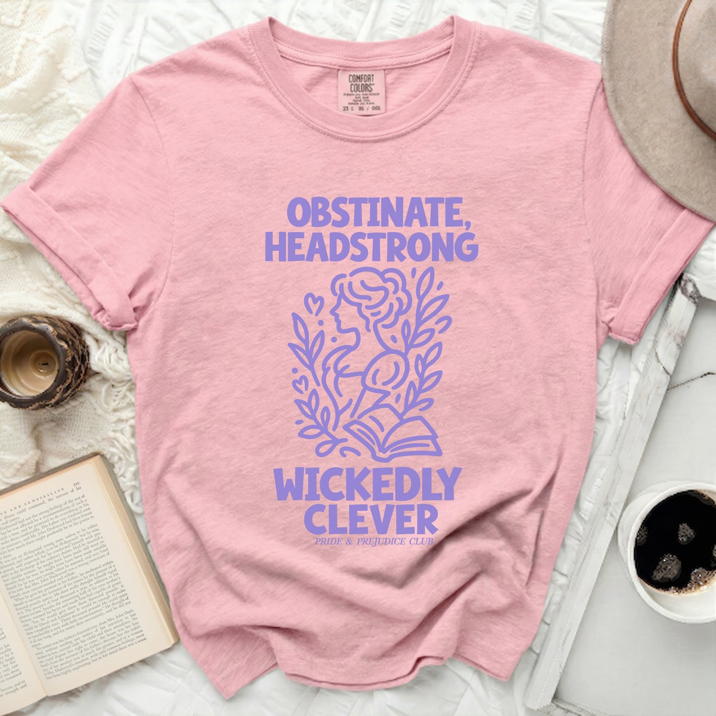 Pink Comfort Colors t-shirt with purple text and graphic of a woman's profile.