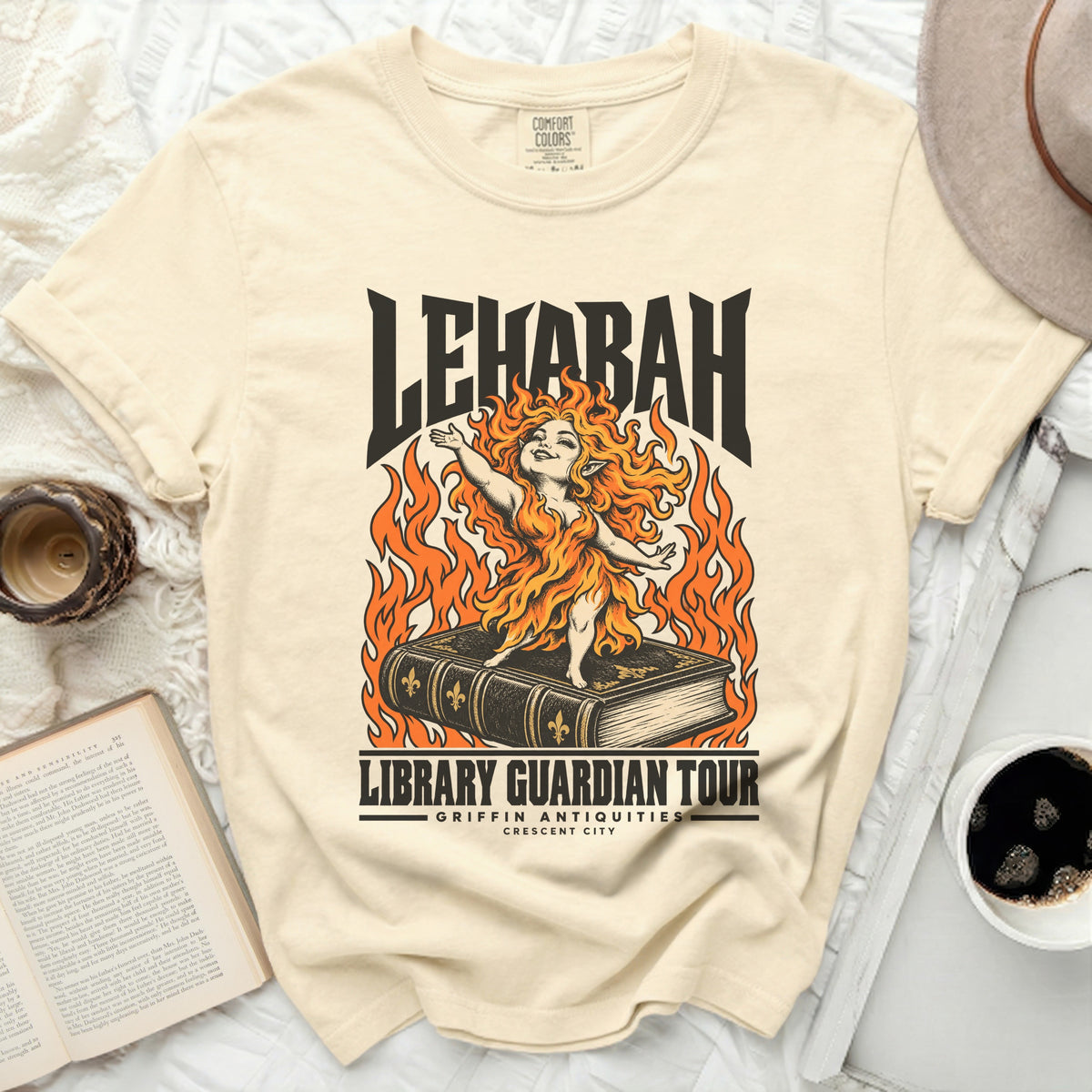Cream t-shirt with "LEHABAH LIBRARY GUARDIAN TOUR" text and graphic.
