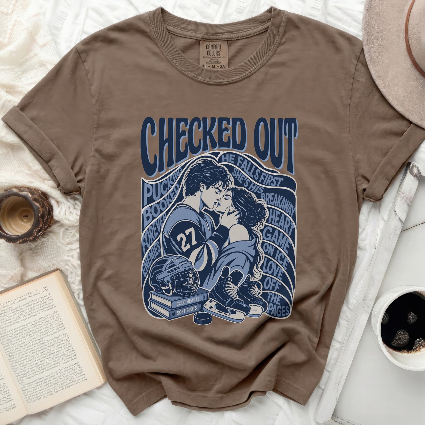 Brown t-shirt with "Checked Out" hockey romance graphic.