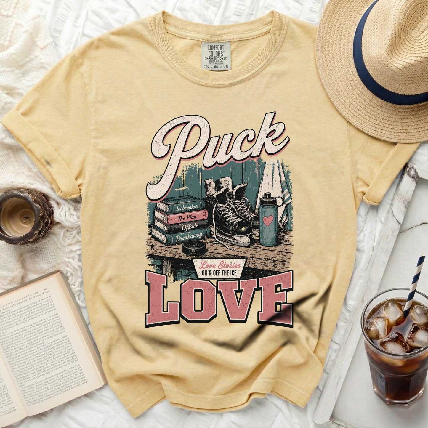 Yellow t-shirt with "Puck Love Stories ON & OFF THE ICE" text.
