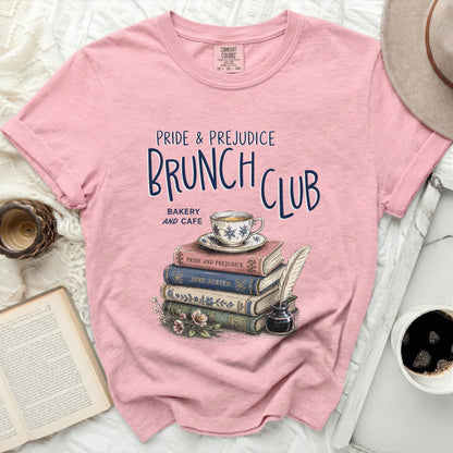 Pink t-shirt with "Pride & Prejudice Brunch Club" text and book stack graphic.