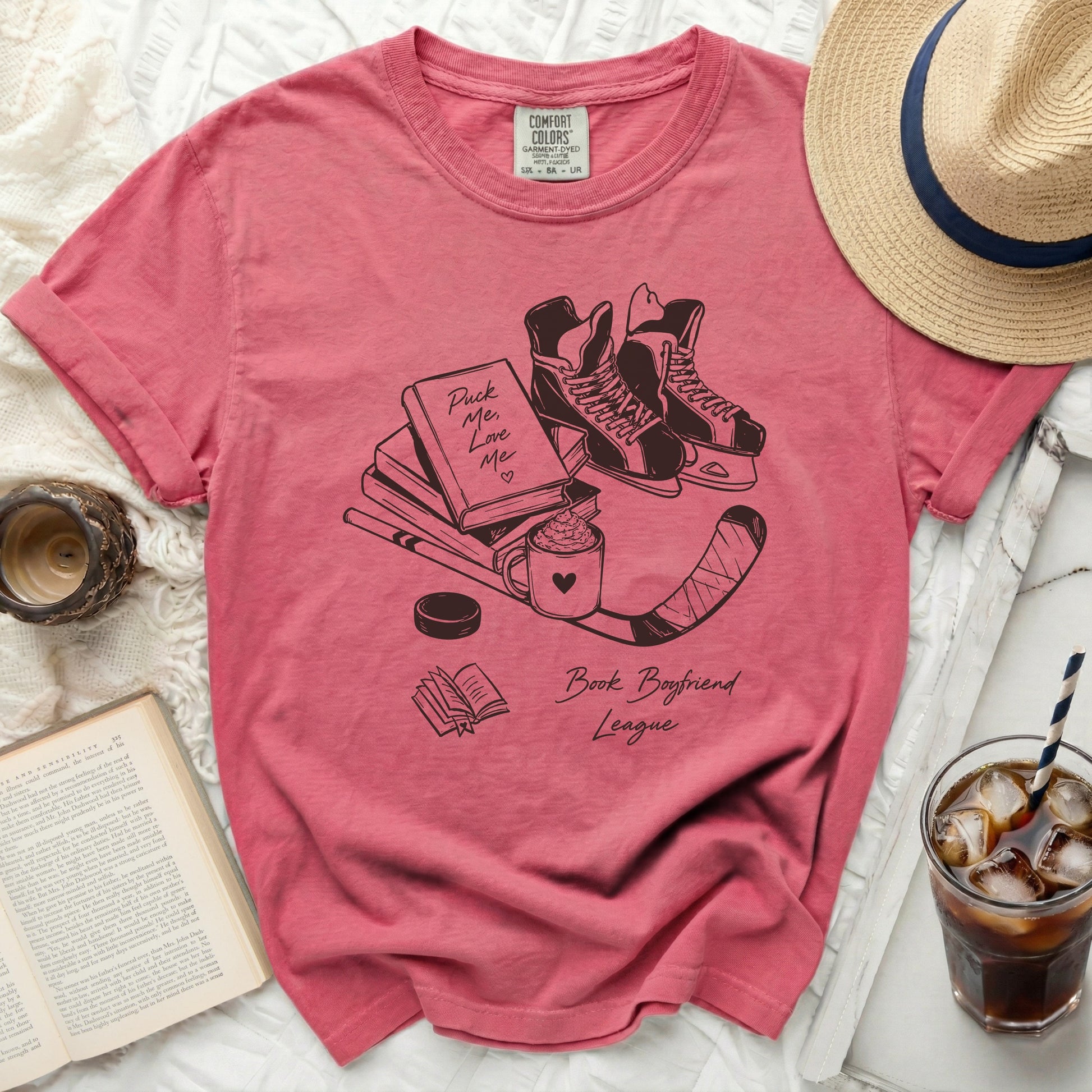 Pink t-shirt with "Puck Me Love Me Book Boyfriend League" text and hockey illustration.