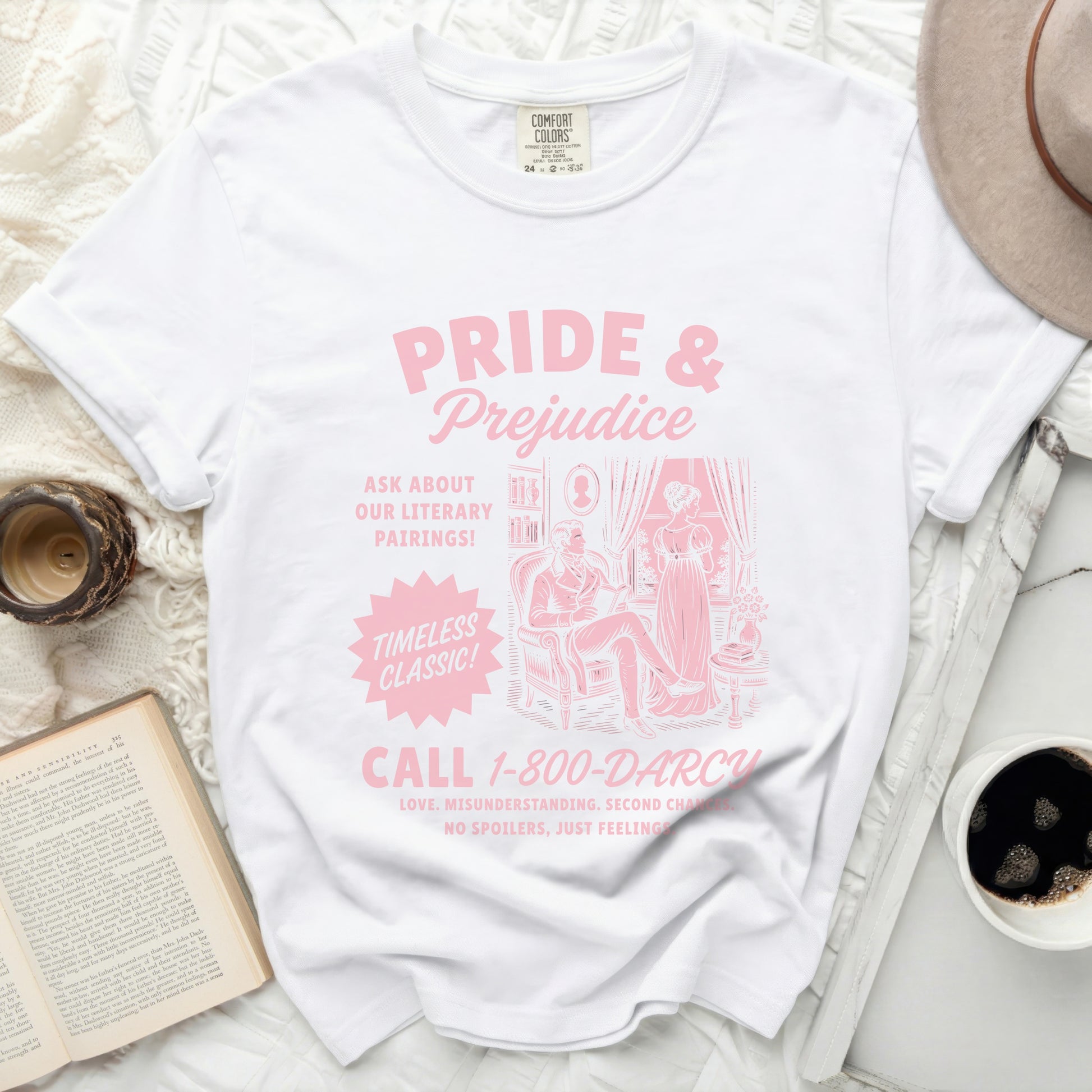 White t-shirt with "Pride & Prejudice" design: "Call 1-800-DARCY"