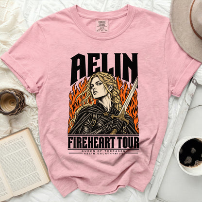 Pink t-shirt with "Aelin Fireheart Tour" graphic of a woman with sword.