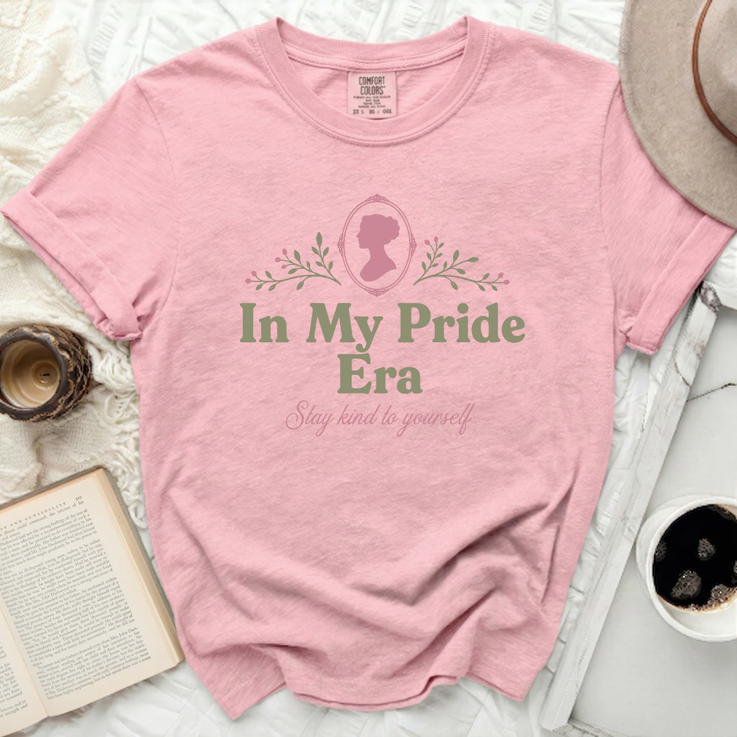 Pink t-shirt with "In My Pride Era" and "Stay kind to yourself" text.