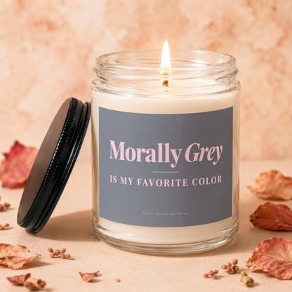 Lit candle in glass jar with "Morally Grey Is My Favorite Color" text.