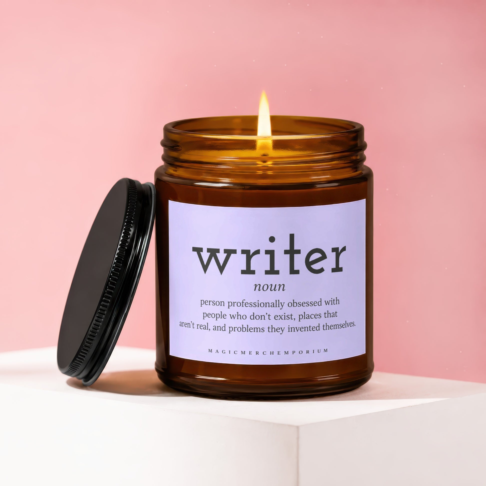 Amber candle with lit flame, "writer" definition on label.