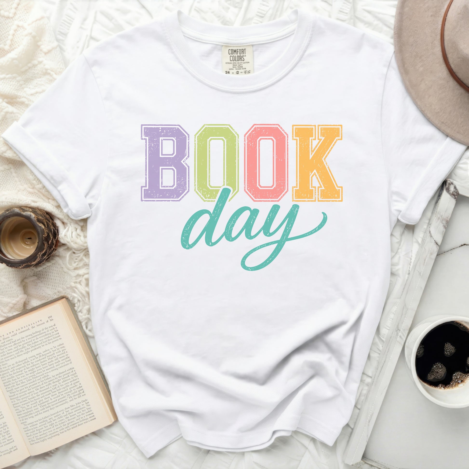 White t-shirt with "BOOK day" in colorful block letters.