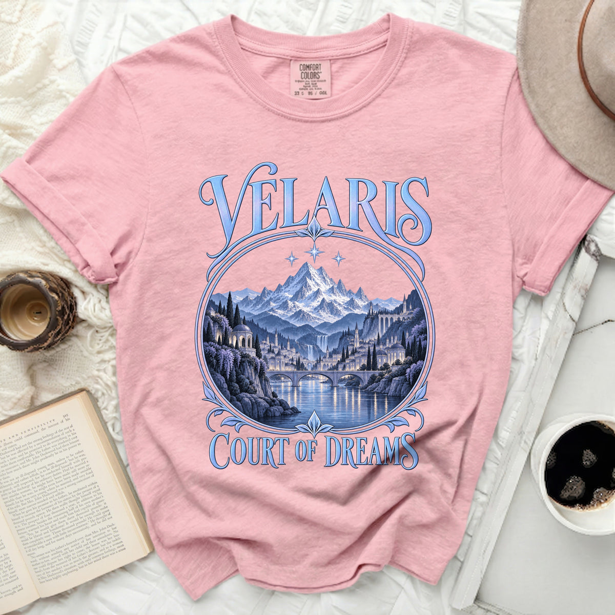 Pink t-shirt with "Velaris Court of Dreams" text and fantasy city landscape design.