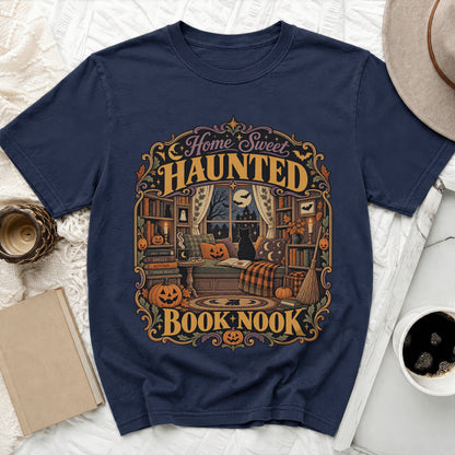 Dark blue t-shirt with "Home Sweet Haunted Book Nook" Halloween graphic.