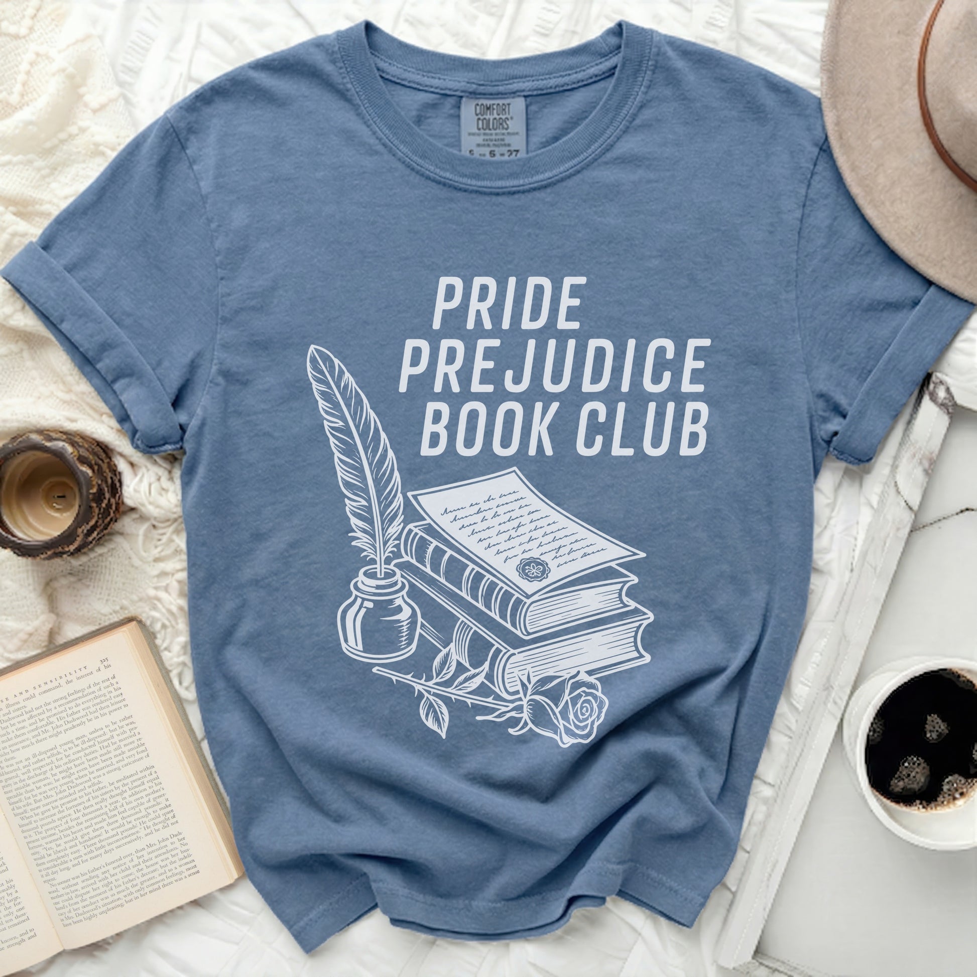 Blue t-shirt with "Pride Prejudice Book Club" and stack of books design.