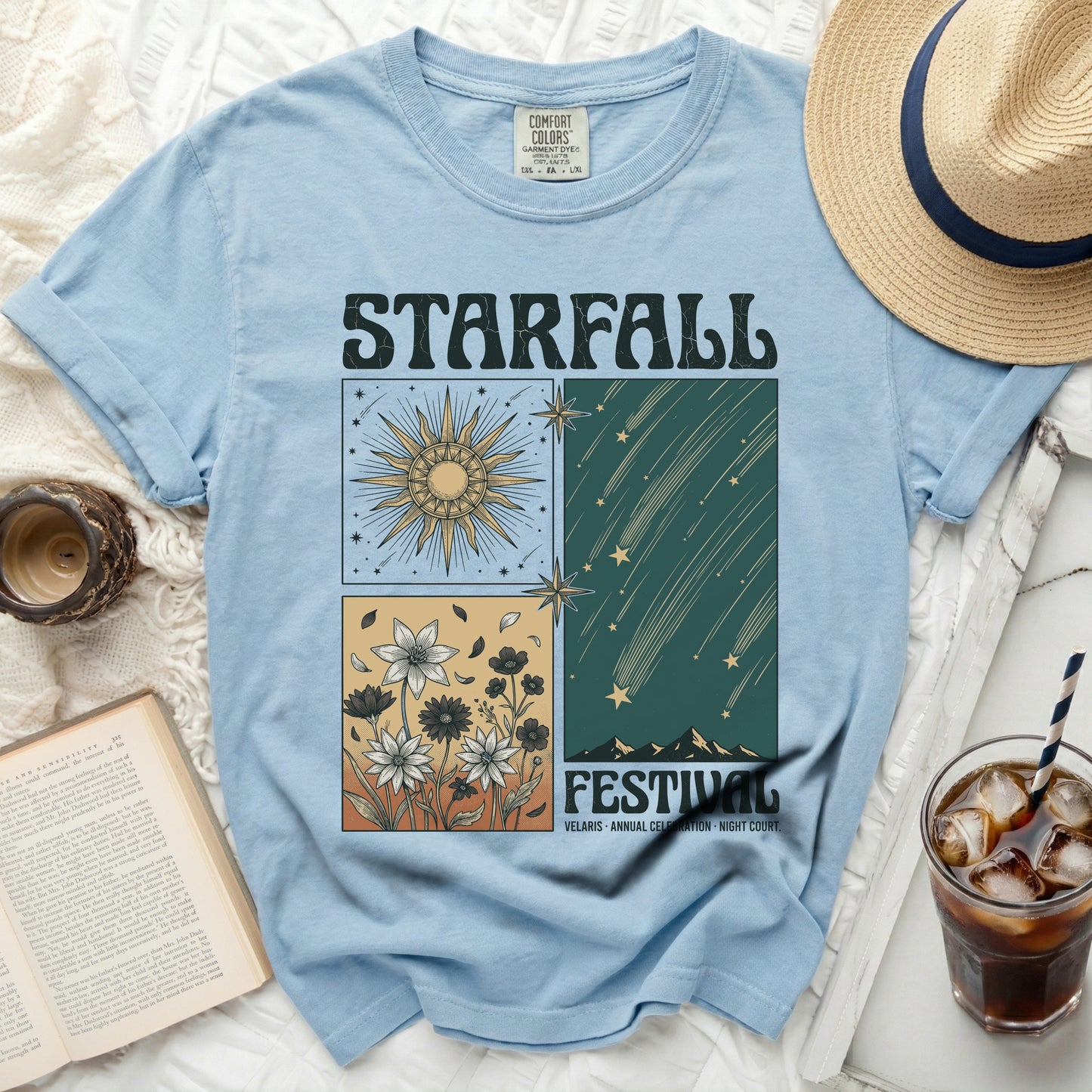 Blue t-shirt with "Starfall Festival" graphic featuring sun, flowers, and shooting stars.