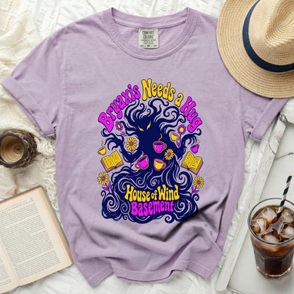 Purple t-shirt with "Bryaxis Needs a Hug" and "House of Wind Basement" text graphic.