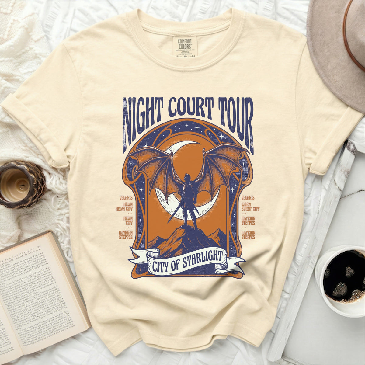 T-shirt with "Night Court Tour City of Starlight" graphic and city names.