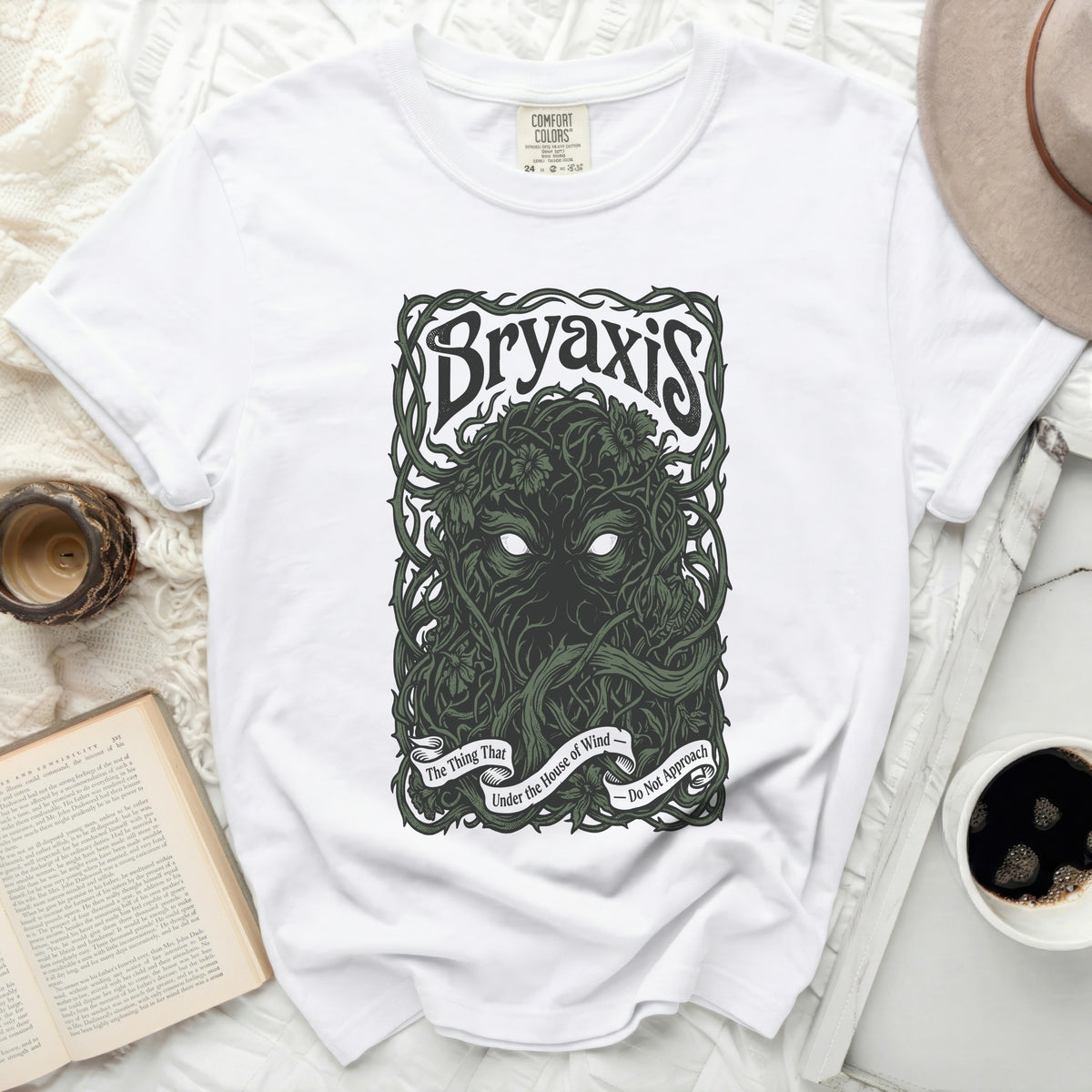 White t-shirt with "Bryaxis" and a vine-covered face graphic.