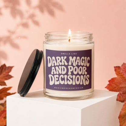 Candle with "Smells Like Dark Magic And Poor Decisions" text on a purple label.