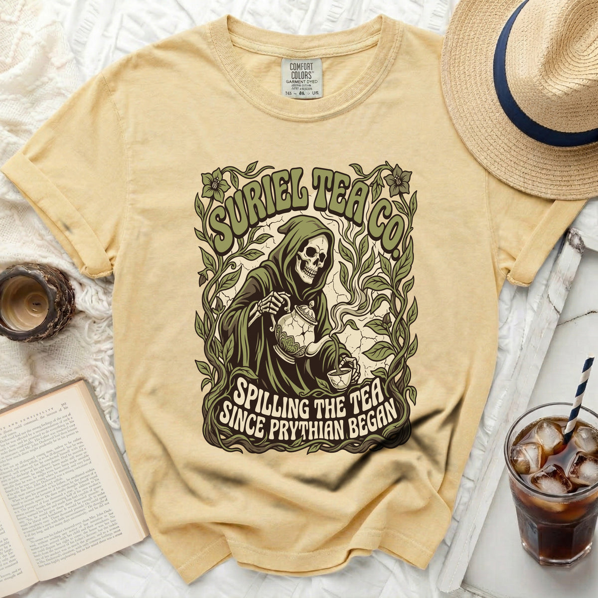 Grim reaper pouring tea with "Suriel Tea Co. Spilling The Tea Since Prythian Began" text.