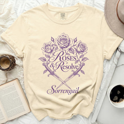 Cream t-shirt with purple roses, swords, and text "ROSES & Resolve Sorrengail".