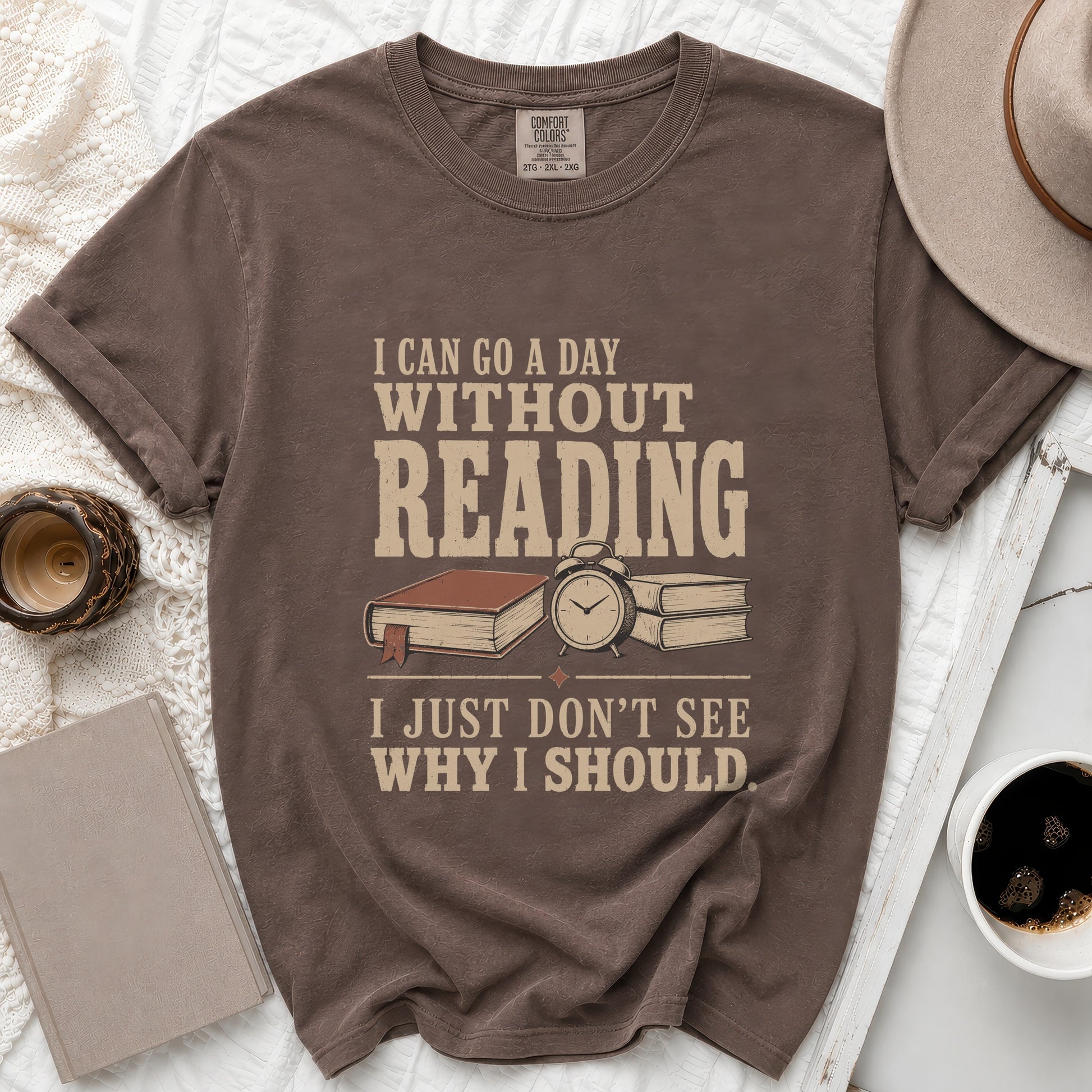 Brown t-shirt with "I can go a day without reading, I just don't see why I should" graphic.