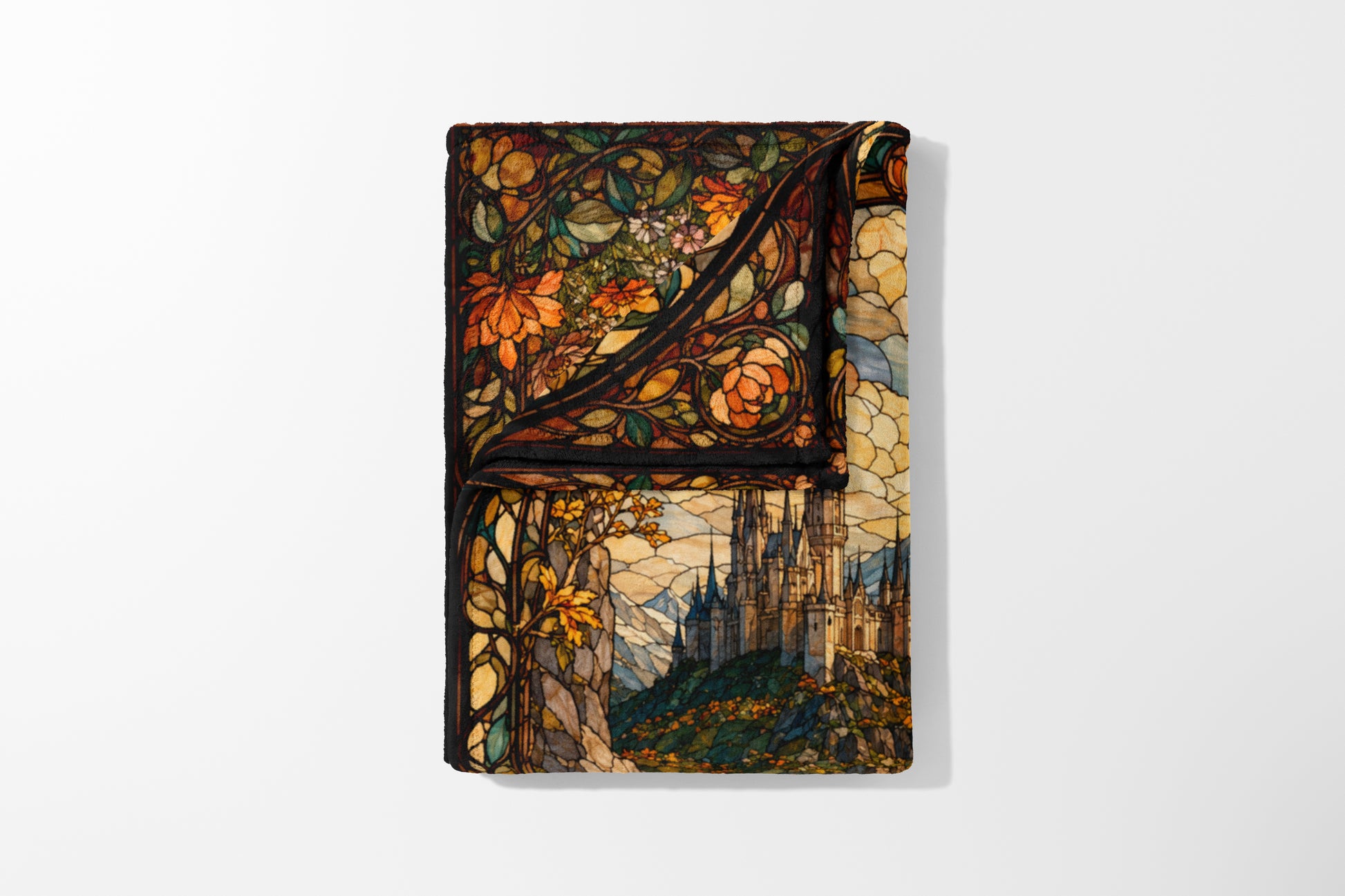 Faux stained glass blanket features a castle on a hill with floral borders.