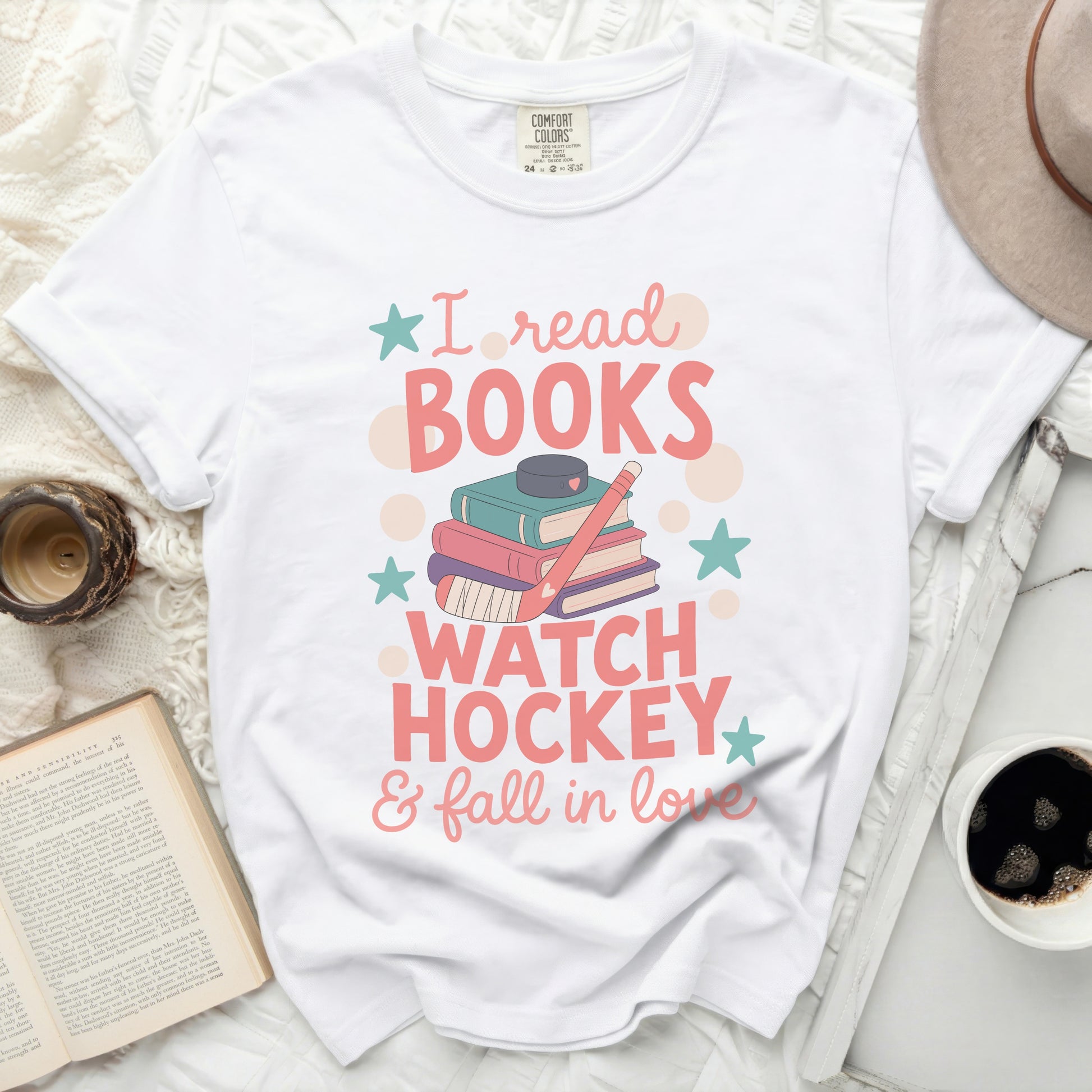 White t-shirt with "I read books, watch hockey & fall in love" graphic.
