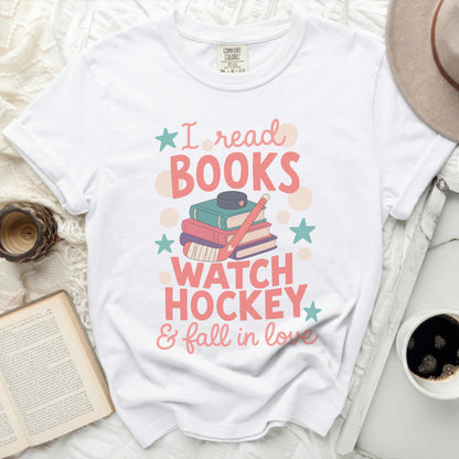 White t-shirt with "I read books, watch hockey & fall in love" graphic.
