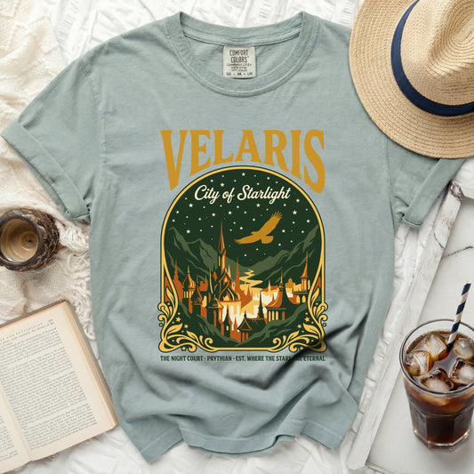 Light blue t-shirt with "Velaris City of Starlight" graphic and starry night scene.