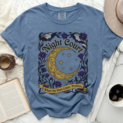 Blue t-shirt with gold, purple, and black "Night Court Where the Stars Listen · Prythian" graphic.