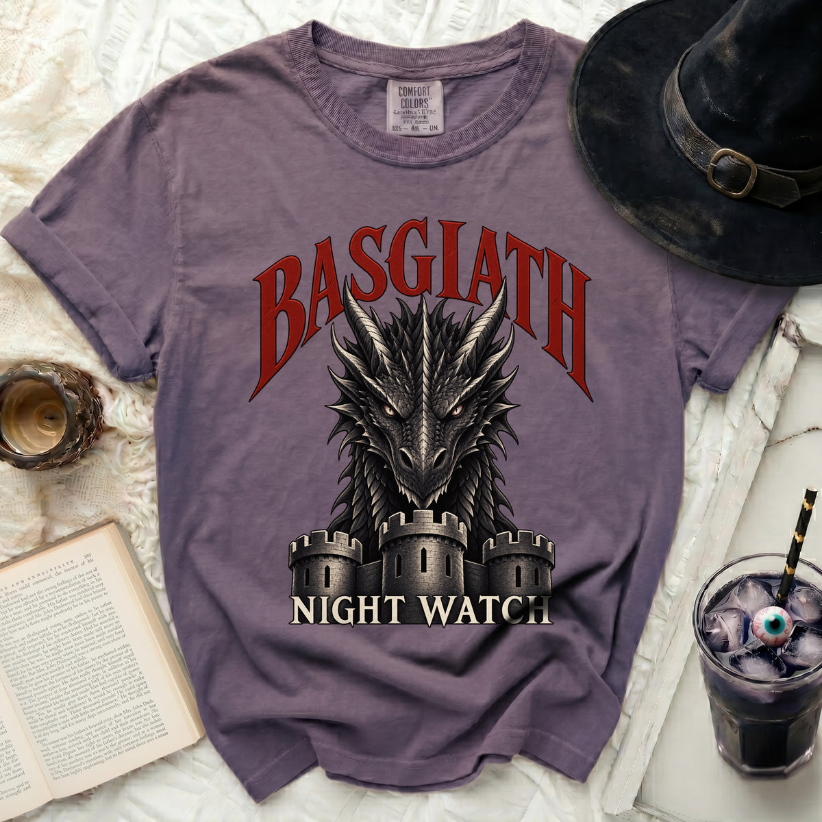 Purple t-shirt with dragon and castle graphic reading "BASGLATH NIGHT WATCH."