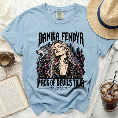 Danika Fendyr Pack of Devils Tour graphic tee with wolf and city illustration.
