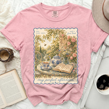 Pink t-shirt with "My perfect afternoon" graphic of tea and book.