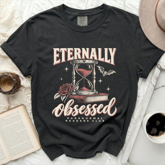 Black t-shirt with "Eternally Obsessed Paranormal Readers Club" graphic.
