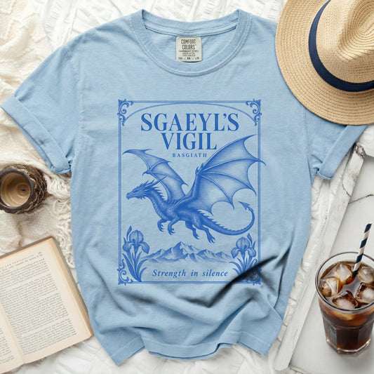 Light blue t-shirt with blue dragon design, "Sgaeyl's Vigil" text.