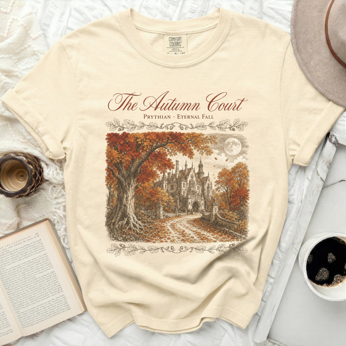 The Autumn Court t-shirt features an illustration of a gothic manor in fall foliage.